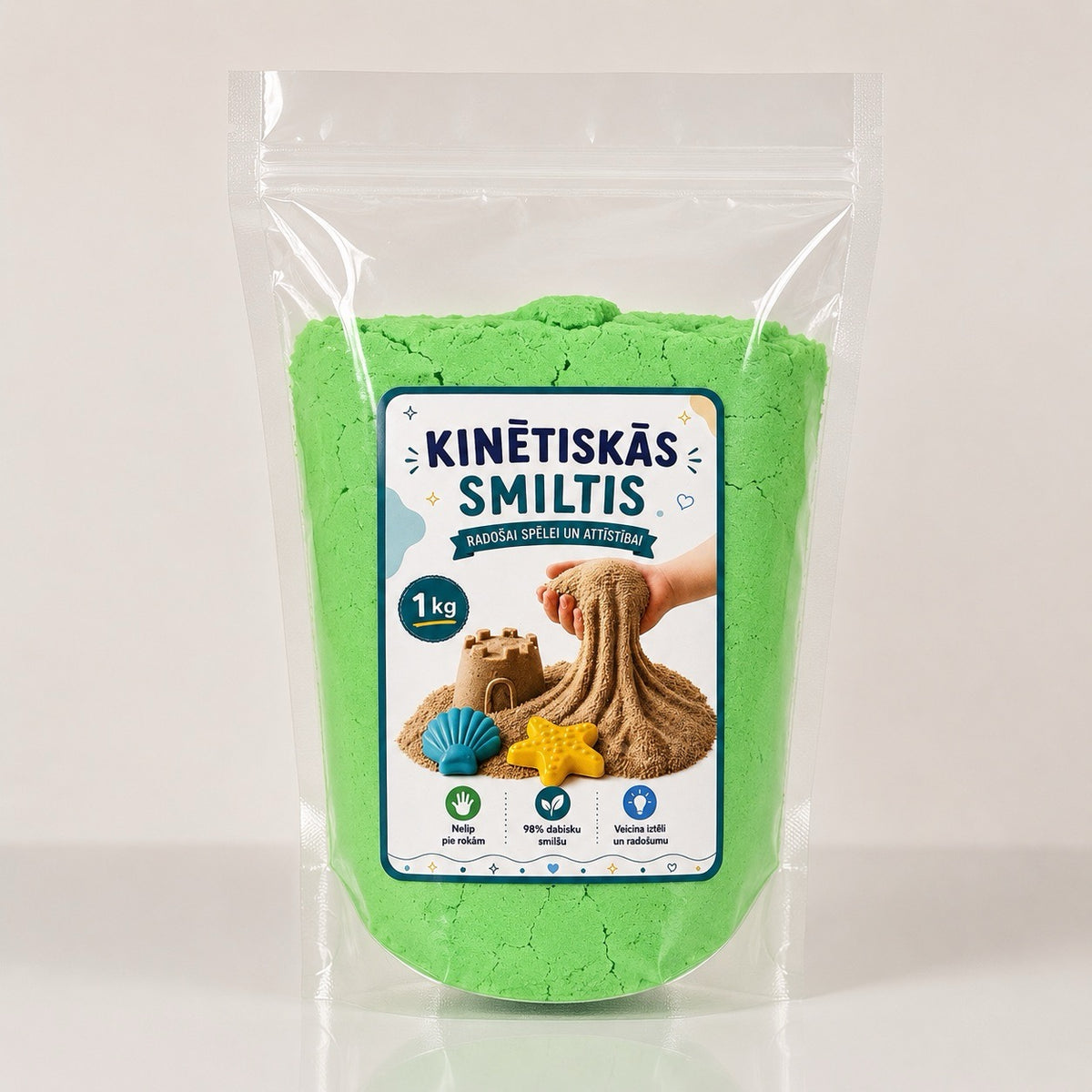 Zaļas kinētiskās smiltis sensorām rotaļām